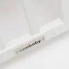 A close-up of a white baby crib with a metal nameplate that says "newbaby". Anteprima dell’immagine prodotto