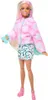 A Barbie doll standing against a white background, dressed in winter-themed clothing. Voir les images du produit