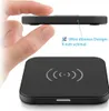 A hand is holding a very thin wireless charging pad, with a close-up view of the pad below. Produktbild-Vorschau