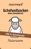 A label for wool socks featuring a cartoon sheep illustration. Produktbild-Vorschau