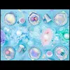 A collection of mermaid-themed party supplies arranged on a light blue background. Produktbild-Vorschau