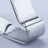 A close-up shot of a shiny metal object, likely a cookie cutter, against a light gray background. Podgląd zdjęcia produktu
