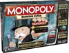 The image shows the box of the Monopoly Banking Ultra board game, featuring Mr. Monopoly holding a credit card and a banking unit. Produktbild-Vorschau