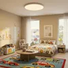 A child's bedroom with a bed, toys, and a rug. Anteprima dell’immagine prodotto