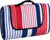 A folded picnic blanket with red, white, and blue stripes. Podgląd zdjęcia produktu