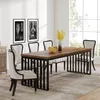A dining room scene with a wooden table and chairs, set against a large window. Produktbild-Vorschau