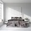 A bedroom scene with a bed featuring a duvet cover with a kitten print. Produktbild-Vorschau