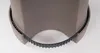 Close-up view of the bottom of a brown planter with a black ribbed band around its base. Voir les images du produit