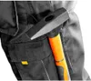 A close-up shot of a hammer attached to the side of black work pants. Anteprima dell’immagine prodotto