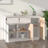 A white and wood sideboard with open doors and drawers, displaying various kitchen items and decorative elements. Náhled obrázku produktu