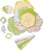 A collection of colorful paper cutouts arranged in a flower-like shape, along with other craft supplies. Náhled obrázku produktu