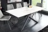 A dining room with a marble-patterned extendable table and chairs. Produktbild-Vorschau