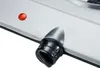Close-up of a control knob and indicator light on a silver appliance. Náhled obrázku produktu