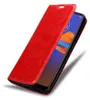 A red flip case for a smartphone, shown from a diagonal angle with the cover partially open. Podgląd zdjęcia produktu
