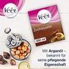 A product shot of Veet sugar paste with argan oil, featuring the packaging, a decorative bowl of argan nuts, and descriptive text. Anteprima dell’immagine prodotto