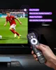 A person is holding a remote control in front of a TV screen showing a soccer game. Voice commands are displayed as speech bubbles. Náhled obrázku produktu