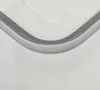 Close-up of the corner of a clear plastic storage box with a gray seal. Podgląd zdjęcia produktu