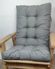 A grey cushion on a wooden chair. Produktbild-Vorschau