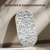 A cracked oval mirror with a gold frame leaning against a wall, with text overlay. Náhled obrázku produktu