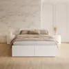 A bedroom scene with a bed, nightstands, and decorative wall paneling. Produktbild-Vorschau