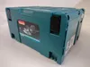 A teal colored tool case with a label showing a power tool. Podgląd zdjęcia produktu