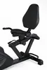 A close-up view of the seat and armrests of a recumbent exercise bike. Produktbild-Vorschau
