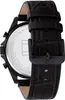 A close-up view of the back of a black Tommy Hilfiger watch with a black leather strap. Produktbild-Vorschau