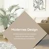 Interior scene with a plant, couch, and artwork, overlaid with text about modern design. Produktbild-Vorschau