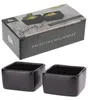 A product shot of a set of two black ceramic serving bowls, with the packaging box in the background. Anteprima dell’immagine prodotto