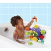 A young child is playing with a bath toy in a bathtub. Podgląd zdjęcia produktu