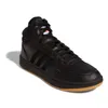 A black Adidas Hoops 3.0 Mid sneaker with a gum sole is shown from a side angle against a white background. Voir les images du produit