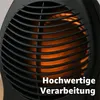 Close-up of the heating element and grille of a black electric heater. Produktbild-Vorschau