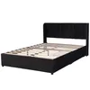 A black upholstered bed frame with a slatted mattress base, shown from a side angle. Anteprima dell’immagine prodotto