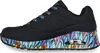 A side view of a black Skechers sneaker with a colorful, graffiti-like pattern on the sole. Náhled obrázku produktu