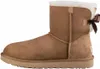 A side view of a single brown Ugg boot with a bow on the back, set against a white background. Produktbild-Vorschau