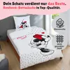 A bed with Mickey and Minnie Mouse themed bedding. Produktbild-Vorschau