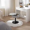 A vanity stool with storage is placed on a fluffy rug in front of a vanity table. Produktbild-Vorschau