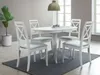 A dining table and chairs set in a well-lit room with a large plant. Anteprima dell’immagine prodotto