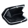 An open black coin purse with a metal clasp. Anteprima dell’immagine prodotto