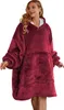A woman wearing a burgundy blanket sweatshirt. Produktbild-Vorschau