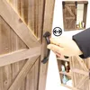 A hand is shown opening a wooden cabinet with a sliding barn door, revealing shelves with toiletries inside. A smaller inset image shows the cabinet with its sliding door closed. Náhled obrázku produktu