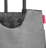 A close-up view of the top portion of a gray shopping bag with black handles and a red brand tag. Podgląd zdjęcia produktu