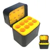 A black and yellow battery charger with its lid open, showing the charging slots. Produktbild-Vorschau