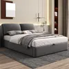 A modern bedroom with a gray upholstered bed as the main focus. Náhled obrázku produktu