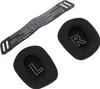 A black headband and two black ear pads for a gaming headset are laid out on a white background. Náhled obrázku produktu