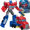 A Transformers Earthspark Warrior Optimus Prime toy in robot and truck mode, displayed on a white background with packaging in the background. Produktbild-Vorschau