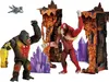 Two ape-like figures, one black and one red, are posed in a volcanic-themed playset with purple crystals. Náhľad obrázku produktu