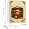 A festive calendar featuring a cute owl in a Santa hat and scarf, set against a Christmas tree background. Produktbild-Vorschau