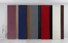 A row of fabric panels in various colors, displayed vertically against a white wall. Produktbild-Vorschau