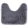 A gray U-shaped bath mat with a fluffy texture, shown from a top-down perspective on a white background. Náhled obrázku produktu